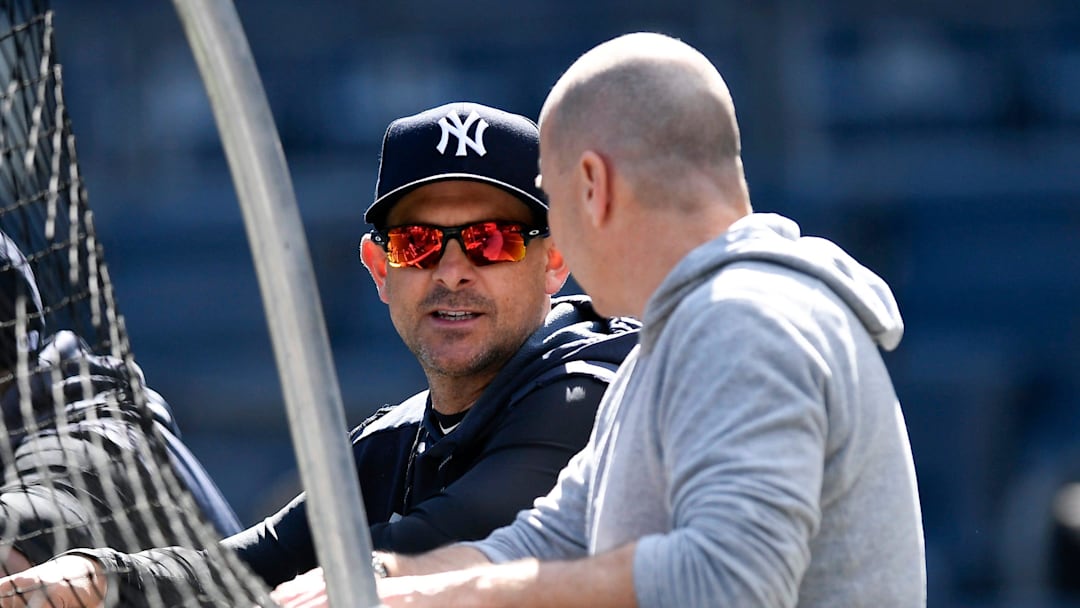 New York Yankees manager Aaron Boone, left, and general manager Brian Cashman talk during the team workout on Thursday, Oct. 10, 2019, in the Bronx.

Yankees Workout
