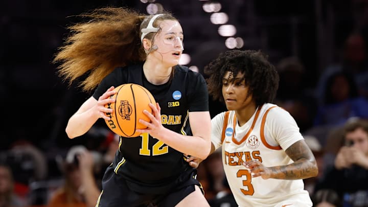 Mar 30, 2026; Fort Worth, TX, USA;  Michigan Wolverines guard Syla Swords (12) controls the ball as Texas Longhorns guard Rori Harmon (3) defends during the first half at Dickies Arena. Mandatory Credit: Chris Jones-Imagn Images