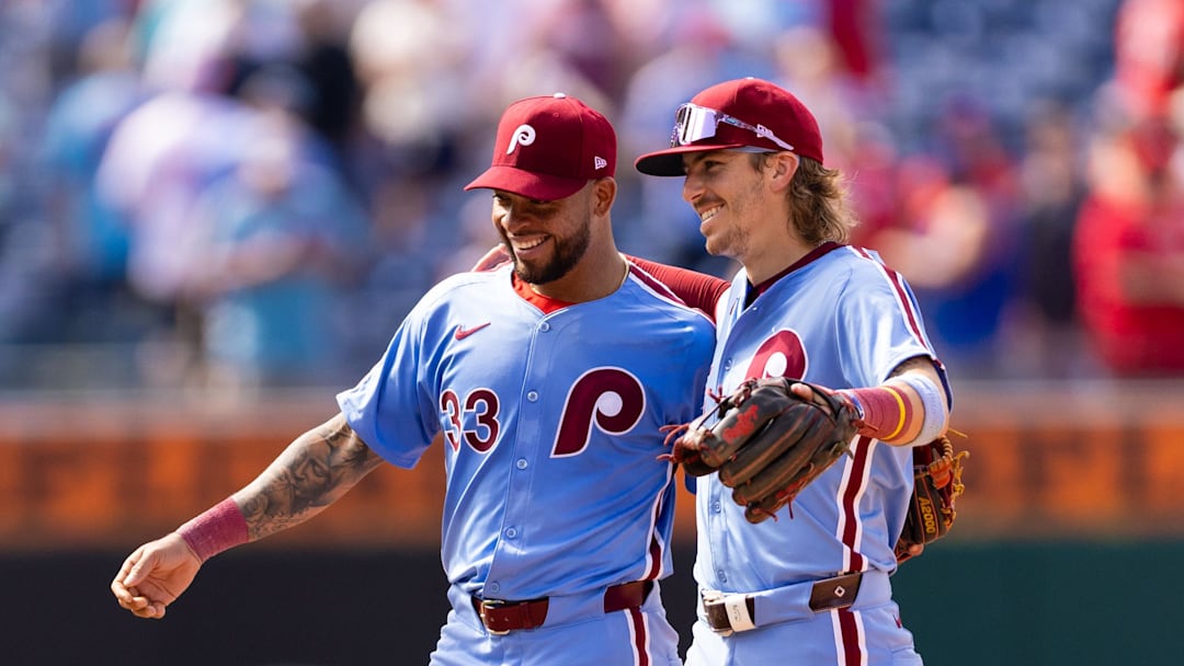 May 23, 2024; Philadelphia, Pennsylvania, USA; Philadelphia Phillies shortstop Edmundo Sosa (33) and second base Bryson Stott (5) celebrate a victory against the Texas Rangers at Citizens Bank Park. 