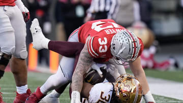 Nov 18, 2023; Columbus, Ohio, USA; Ohio State Buckeyes defensive end Jack Sawyer (33) tackles Minnesota Golden Gophers running back Jordan Nubin (30) during the first half of the NCAA football game at Ohio Stadium.