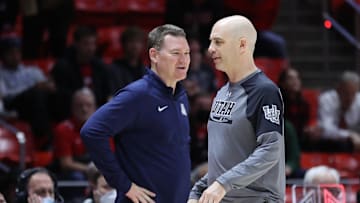 Feb 24, 2022; Salt Lake City, Utah, USA; Arizona Wildcats head coach Tommy Lloyd and Utah Utes head coach Craig Smith speak after their game at Jon M. Huntsman Center. Mandatory Credit: Rob Gray-Imagn Images