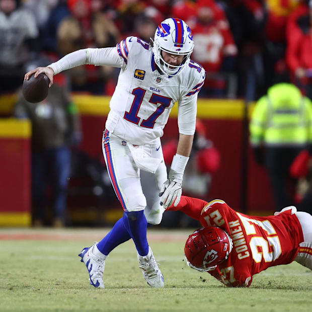 Buffalo Bills quarterback Josh Allen (17) rushes the ball past Kansas City Chiefs safety Chamarri Conner (27