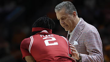 Jan 4, 2025; Knoxville, Tennessee, USA; Arkansas Razorbacks head coach John Calipari speaks with guard Boogie Fland (2) during the first half against the Tennessee Volunteers at Thompson-Boling Arena at Food City Center. Mandatory Credit: Randy Sartin-Imagn Images