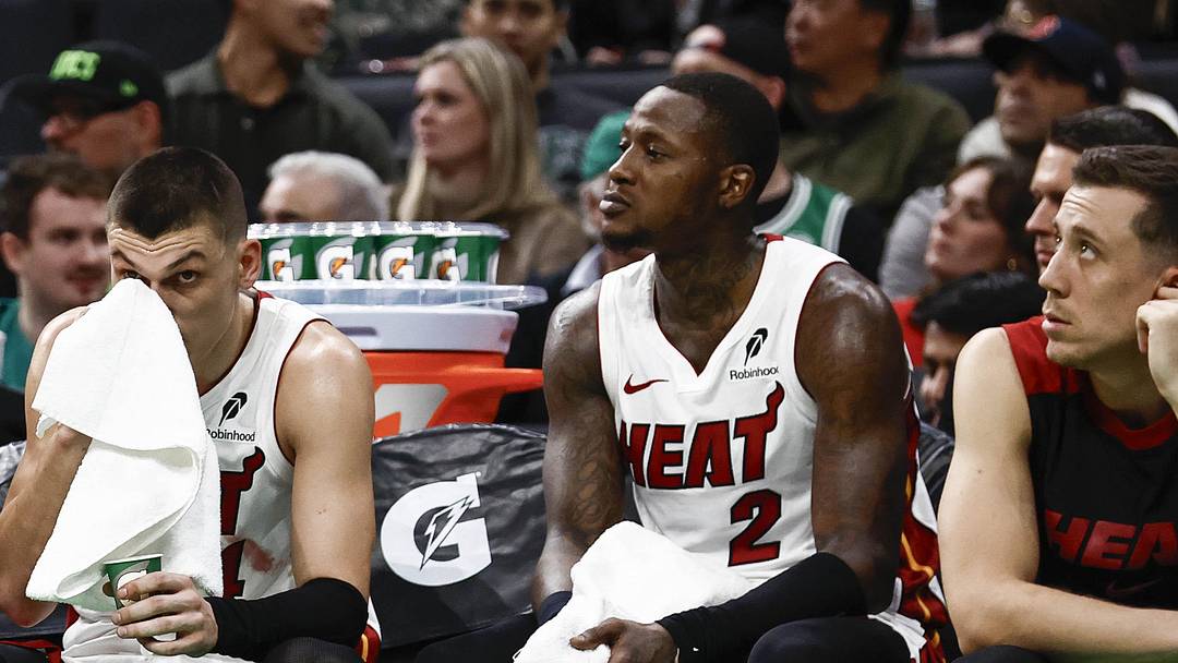 Dec 2, 2024; Boston, Massachusetts, USA; Miami Heat players (left to right) center Bam Adebayo (13), guard Tyler Herro (14), guard Terry Rozier (2) and forward Duncan Robinson (55) sit on the bench during the fourth quarter of their loss to the Boston Celtics at TD Garden. Mandatory Credit: Winslow Townson-Imagn Images