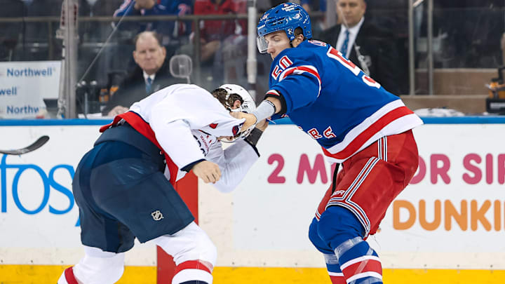 Apr 5, 2026; New York, New York, USA; New York Rangers left wing Will Cuylle (50) fights with Washington Capitals defenseman Jakob Chychrun (6) during the second period at Madison Square Garden.
