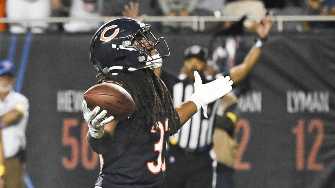 Aug 17, 2025; Chicago, Illinois, USA;  Chicago Bears running back Ian Wheeler (33) raises his arms after scoring  a touchdown during the second half against the Buffalo Bills at Soldier Field.