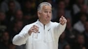 Purdue Boilermakers head coach Matt Painter points down the court 