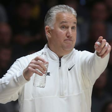 Purdue Boilermakers head coach Matt Painter points down the court