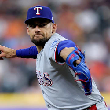 Jul 13, 2025; Houston, Texas, USA; Texas Rangers starting pitcher Nathan Eovaldi (17) delivers a pitch against the Houston Astros during the first inning at Daikin Park.