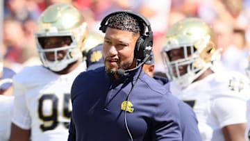 Sep 27, 2025; Fayetteville, Arkansas, USA; Notre Dame Fighting Irish head coach Marcus Freeman during the first quarter against the Arkansas Razorbacks at Donald W. Reynolds Razorback Stadium. Mandatory Credit: Nelson Chenault-Imagn Images