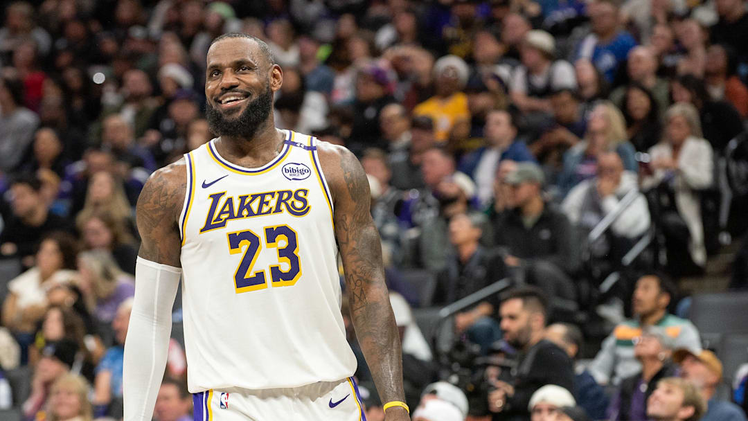 Dec 21, 2024; Sacramento, California, USA; Los Angeles Lakers forward LeBron James (23) smiles after his team scored against the Sacramento Kings during the fourth quarter at Golden 1 Center. Mandatory Credit: Ed Szczepanski-Imagn Images