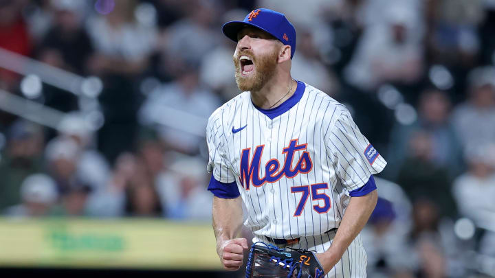 Jun 25, 2024; New York City, New York, USA; New York Mets relief pitcher Reed Garrett (75) reacts after getting the final out against the New York Yankees at Citi Field. Mandatory Credit: Brad Penner-USA TODAY Sports