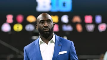 Jul 24, 2024; Indianapolis, IN, USA; UCLA Bruins head coach DeShaun Foster walks to the media podium during the Big 10 football media day at Lucas Oil Stadium. Mandatory Credit: Robert Goddin-USA TODAY Sports