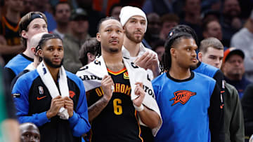 Jan 5, 2025; Oklahoma City, Oklahoma, USA; Oklahoma City Thunder guard Isaiah Joe (11), forward Jaylin Williams (6), forward Chet Holmgren (7), and forward Dillon Jones (3) watch their team play against the Boston Celtics during the fourth quarter at Paycom Center. Mandatory Credit: Alonzo Adams-Imagn Images