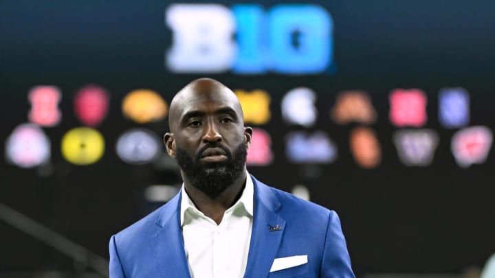 Jul 24, 2024; Indianapolis, IN, USA; UCLA Bruins head coach DeShaun Foster walks to the media podium during the Big 10 football media day at Lucas Oil Stadium. Mandatory Credit: Robert Goddin-USA TODAY Sports