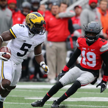 Nov 26, 2016; Columbus, OH, USA; Michigan Wolverines linebacker Jabrill Peppers (5) runs as Ohio State Buckeyes defenders Terry McLaurin (83) and Eric Glover-Williams (19) pursue during the second quarter at Ohio Stadium. Michigan Wolverines lead at half 10-7.  Mandatory Credit: Joe Maiorana-USA TODAY Sports