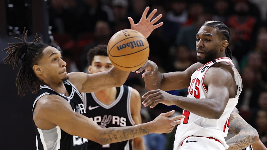 Chicago Bulls forward Patrick Williams (44) battles for the ball with San Antonio Spurs guard Devin Vassell (24) during the first half at United Center. Chicago Bulls forward Patrick Williams (44) battles for the ball with San Antonio Spurs guard Devin Vassell (24) during the first half at United Center.