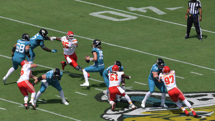 Jacksonville Jaguars quarterback Trevor Lawrence (16) is pressured by Kansas City Chiefs defensive Jacksonville Jaguars quarterback Trevor Lawrence (16) is pressured by Kansas City Chiefs defensive