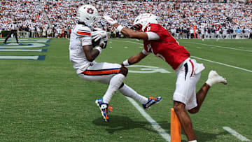 Sep 13, 2025; Auburn, Alabama, USA;  Auburn Tigers wide receiver Cam Coleman (8) makes a touchdown catch as South Alabama Jaguars cornerback Nehemiah Chandler (6) defends during the first quarter at Jordan-Hare Stadium. Mandatory Credit: John Reed-Imagn Images