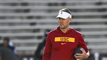 Oct 19, 2024; College Park, Maryland, USA;  Southern California Trojans head coach Lincoln Riley stands on the field before the game against the Maryland Terrapins at SECU Stadium. Mandatory Credit: Tommy Gilligan-Imagn Images