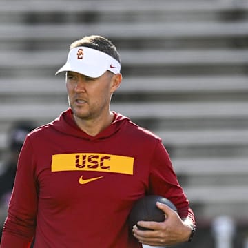 Oct 19, 2024; College Park, Maryland, USA;  Southern California Trojans head coach Lincoln Riley stands on the field before the game against the Maryland Terrapins at SECU Stadium. Mandatory Credit: Tommy Gilligan-Imagn Images