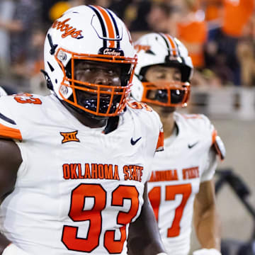 Oklahoma State Cowboys nose tackle Collin Clay (93) against the Arizona State Sun Devils at Mountain America Stadium. Clay will face Arkansas, the program he signed with coming out of high school.