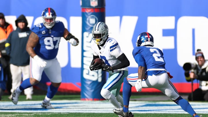 Jan 4, 2026; East Rutherford, New Jersey, USA; Dallas Cowboys wide receiver George Pickens (3) runs after making a catch as New York Giants cornerback Deonte Banks (2) defends during the first quarter at MetLife Stadium. Mandatory Credit: Vincent Carchietta-Imagn Images