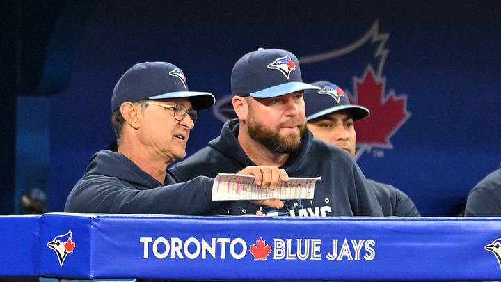 Sep 14, 2023; Toronto, Ontario, CAN;  Toronto Blue Jays bench coach Don Mattingly (23, left) speaks with manager John Schneider (14) during the seventh inning against the Texas Rangers at Rogers Centre. Mandatory Credit: Dan Hamilton-USA TODAY Sports