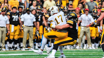 Sep 2, 2017; Iowa City, IA, USA; Wyoming Cowboys quarterback Josh Allen (17) is sacked by Iowa Hawkeyes linebacker Josey Jewell (43) during the second quarter at Kinnick Stadium. Mandatory Credit: Jeffrey Becker-Imagn Images