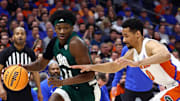 Dec 14, 2022; Tampa, Florida, USA; Ohio Bobcats guard AJ Brown (24) drives to the basket as Florida Gators guard Myreon Jones (0) defends during the first half at Amalie Arena. Mandatory Credit: Kim Klement-Imagn Images