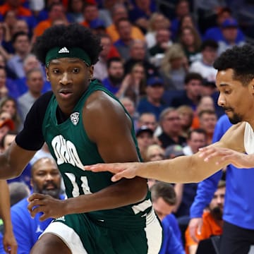 Dec 14, 2022; Tampa, Florida, USA; Ohio Bobcats guard AJ Brown (24) drives to the basket as Florida Gators guard Myreon Jones (0) defends during the first half at Amalie Arena. Mandatory Credit: Kim Klement-Imagn Images