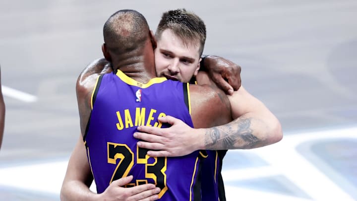Apr 9, 2025; Dallas, Texas, USA;  Los Angeles Lakers guard Luka Doncic (77) celebrates with Los Angeles Lakers forward LeBron James (23) during the fourth quarter against the Dallas Mavericks at American Airlines Center. Mandatory Credit: Kevin Jairaj-Imagn Images
