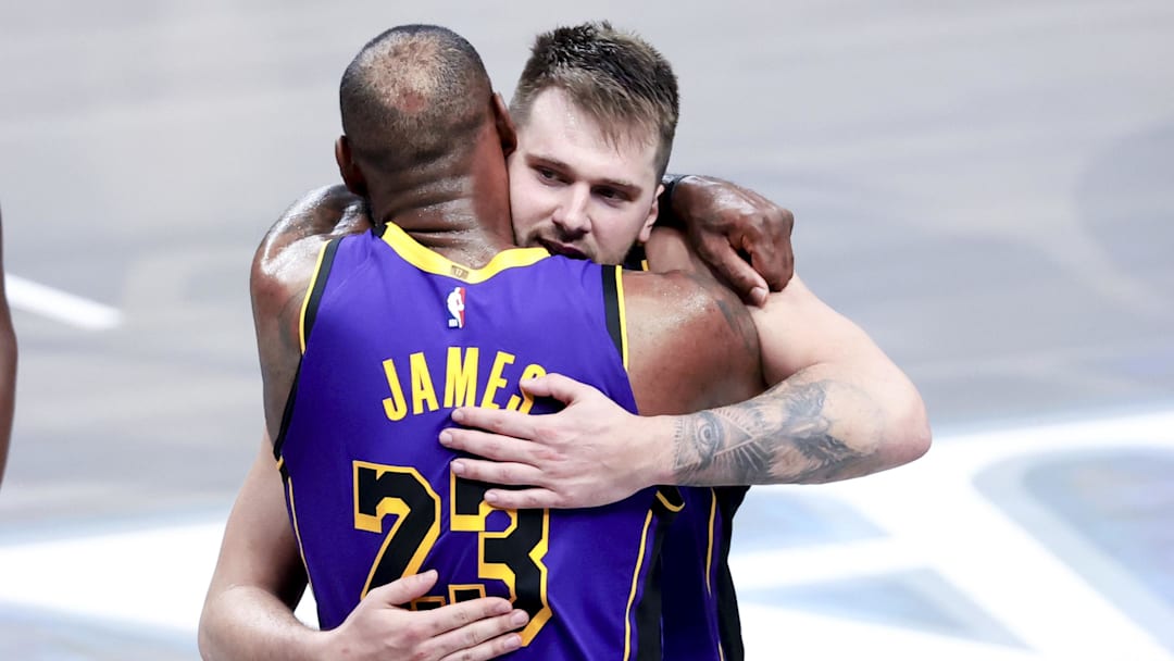 Apr 9, 2025; Dallas, Texas, USA;  Los Angeles Lakers guard Luka Doncic (77) celebrates with Los Angeles Lakers forward LeBron James (23) during the fourth quarter against the Dallas Mavericks at American Airlines Center. Mandatory Credit: Kevin Jairaj-Imagn Images