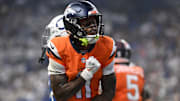 Sep 14, 2025; Indianapolis, Indiana, USA; Denver Broncos wide receiver Troy Franklin (11) celebrates scoring a touchdown during the second quarter against the Indianapolis Colts at Lucas Oil Stadium.