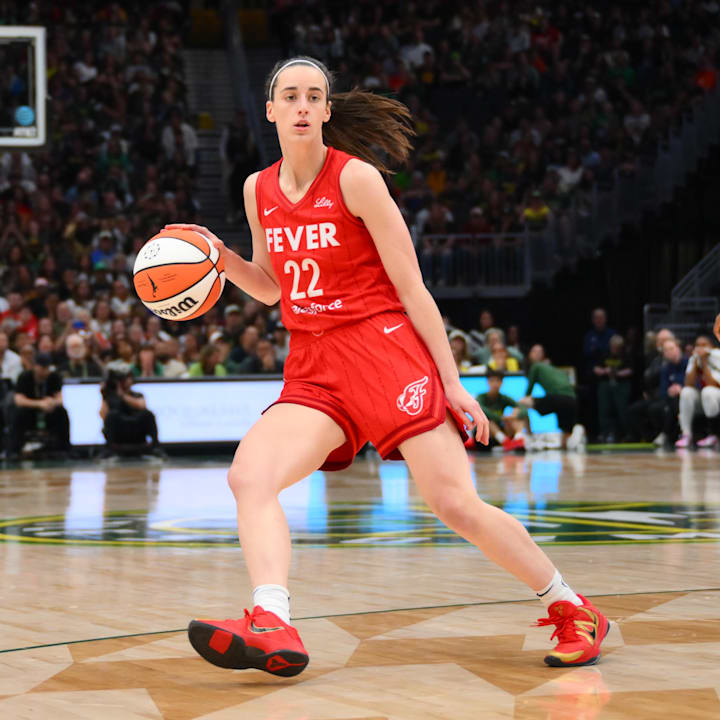 Indiana Fever guard Caitlin Clark dribbles the ball against the Seattle Storm.