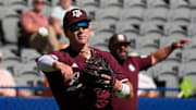 May 21, 2025; Hoover, AL, USA; Texas A&M third baseman Wyatt Henseler (8) fields and throws to first for an out during the game with Mississippi State in the first round of the SEC Baseball Tournament at the Hoover Met.