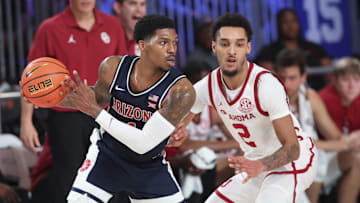 Nov 28, 2024;  Paradise Island, Bahamas, BHS; Arizona Wildcats guard Caleb Love (1) looks to score as Oklahoma Sooners guard Brycen Goodine (2) defends during the first half in the Imperial Arena at the Atlantis Resort.  Mandatory Credit: Kevin Jairaj-Imagn Images