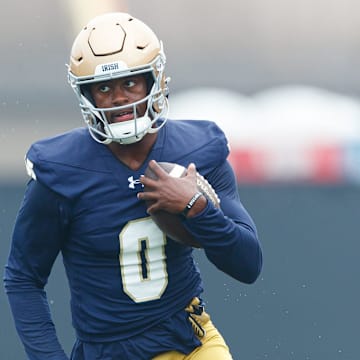Notre Dame wide receiver Malachi Fields runs with the ball during a football practice at Irish Athletic Center on Thursday, July 31, 2025, in South Bend.