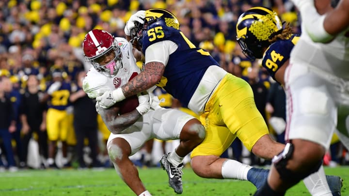 Jan 1, 2024; Pasadena, CA, USA; Michigan Wolverines defensive lineman Mason Graham (55) tackles Alabama Crimson Tide running back Jase McClellan (2) during overtime in the 2024 Rose Bowl college football playoff semifinal game at Rose Bowl. Mandatory Credit: Gary A. Vasquez-USA TODAY Sports