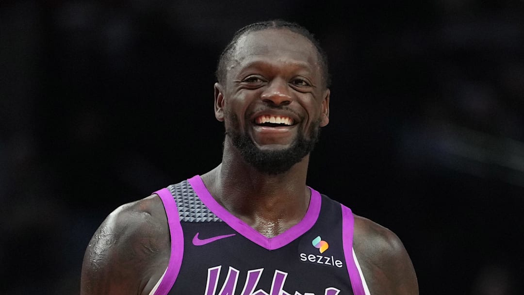 Feb 24, 2026; Portland, Oregon, USA; Minnesota Timberwolves forward Julius Randle (30) and Portland Trail Blazers guard Jrue Holiday (5) share a laugh during the second half at Moda Center. Mandatory Credit: Soobum Im-Imagn Images