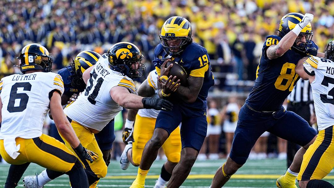 Michigan quarterback Bryce Underwood (19) runs against Iowa defensive lineman Luke Gaffney (51) during the second half at Michigan Stadium in Ann Arbor on Saturday, Sept. 26, 2026.