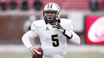 Dec 7, 2013; Dallas, TX, USA; UCF Knights quarterback Blake Bortles (5) runs for a touchdown against the Southern Methodist Mustangs during the second half of an NCAA football game at Gerald J. Ford Stadium. UCF Knights won 17-13. Mandatory Credit: Jim Cowsert-Imagn Images