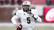 Dec 7, 2013; Dallas, TX, USA; UCF Knights quarterback Blake Bortles (5) runs for a touchdown against the Southern Methodist Mustangs during the second half of an NCAA football game at Gerald J. Ford Stadium. UCF Knights won 17-13. Mandatory Credit: Jim Cowsert-Imagn Images