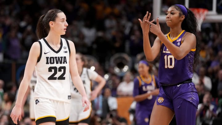 Angel Reese (10) shows Iowa Caitlin Clark her ring finger during the final seconds of the women's NCAA Tournament national championship game.

Syndication Hawkcentral