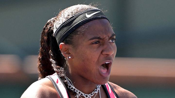 Hailey Baptiste reacts after winning a set