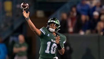 Nov 28, 2024; New Orleans, Louisiana, USA;  Tulane Green Wave quarterback Darian Mensah (10) throws against the Memphis Tigers during the first quarter at Yulman Stadium. Mandatory Credit: Matthew Hinton-Imagn Images