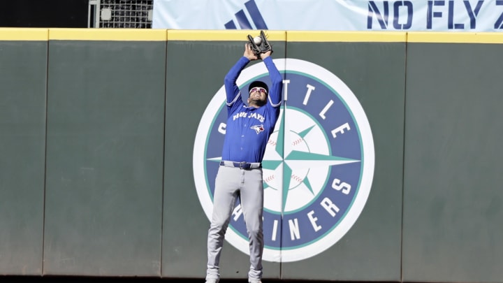 Toronto Blue Jays center fielder Kevin Kiermaier (39) catches a bases leaded fly for the final out hit by Seattle Mariners catcher Cal Raleigh (29) at T-Mobile Park. 
