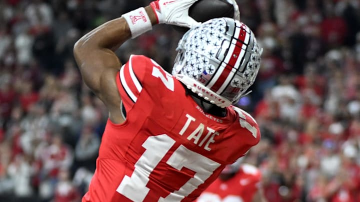 Dec 6, 2025; Indianapolis, IN, USA; Ohio State Buckeyes wide receiver Carnell Tate (17) scores a touchdown against the Indiana Hoosiers in the first quarter during the 2025 Big Ten championship game at Lucas Oil Stadium. Mandatory Credit: Robert Goddin-Imagn Images