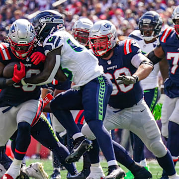 Sep 15, 2024; Foxborough, Massachusetts, USA; New England Patriots running back Rhamondre Stevenson (38) runs the ball against the Seattle Seahawks in the second quarter at Gillette Stadium. Mandatory Credit: David Butler II-Imagn Images