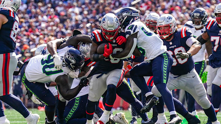 Sep 15, 2024; Foxborough, Massachusetts, USA; New England Patriots running back Rhamondre Stevenson (38) runs the ball against the Seattle Seahawks in the second quarter at Gillette Stadium. Mandatory Credit: David Butler II-Imagn Images